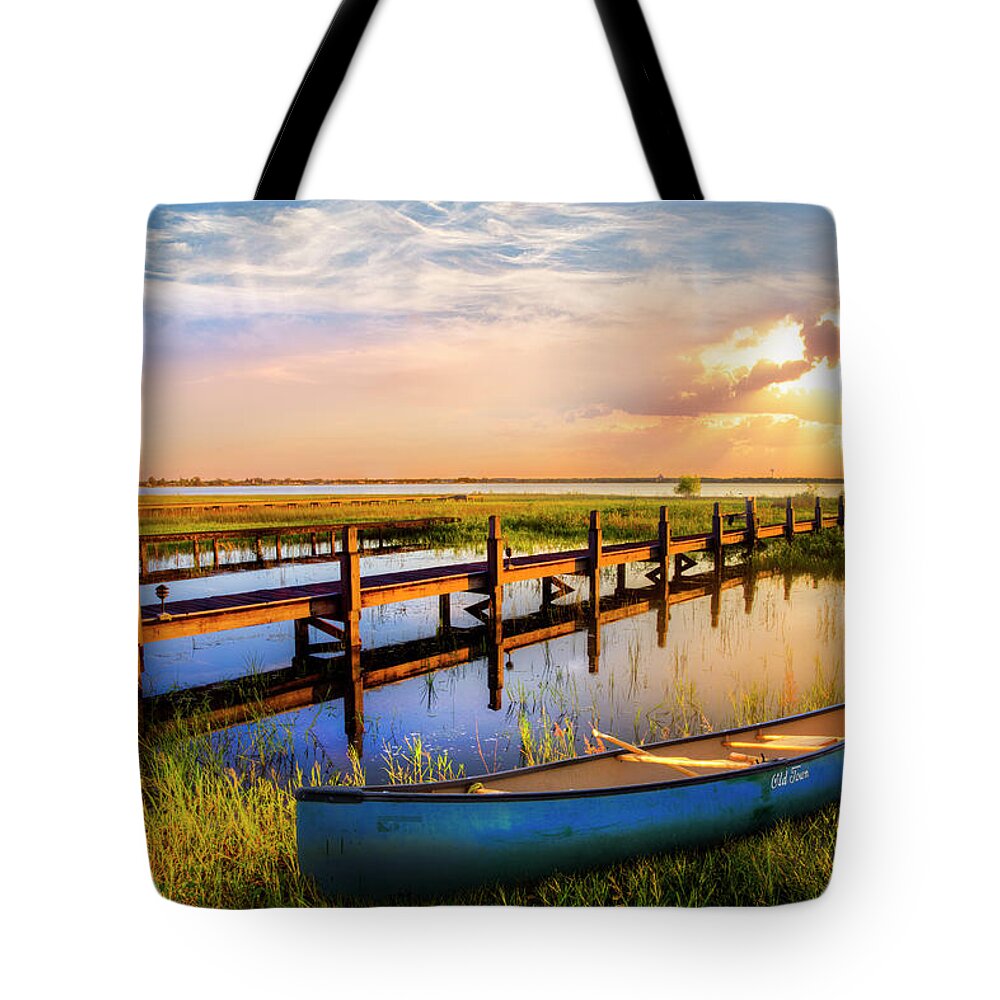 Boats Tote Bag featuring the photograph Evening Light on the Lake by Debra and Dave Vanderlaan