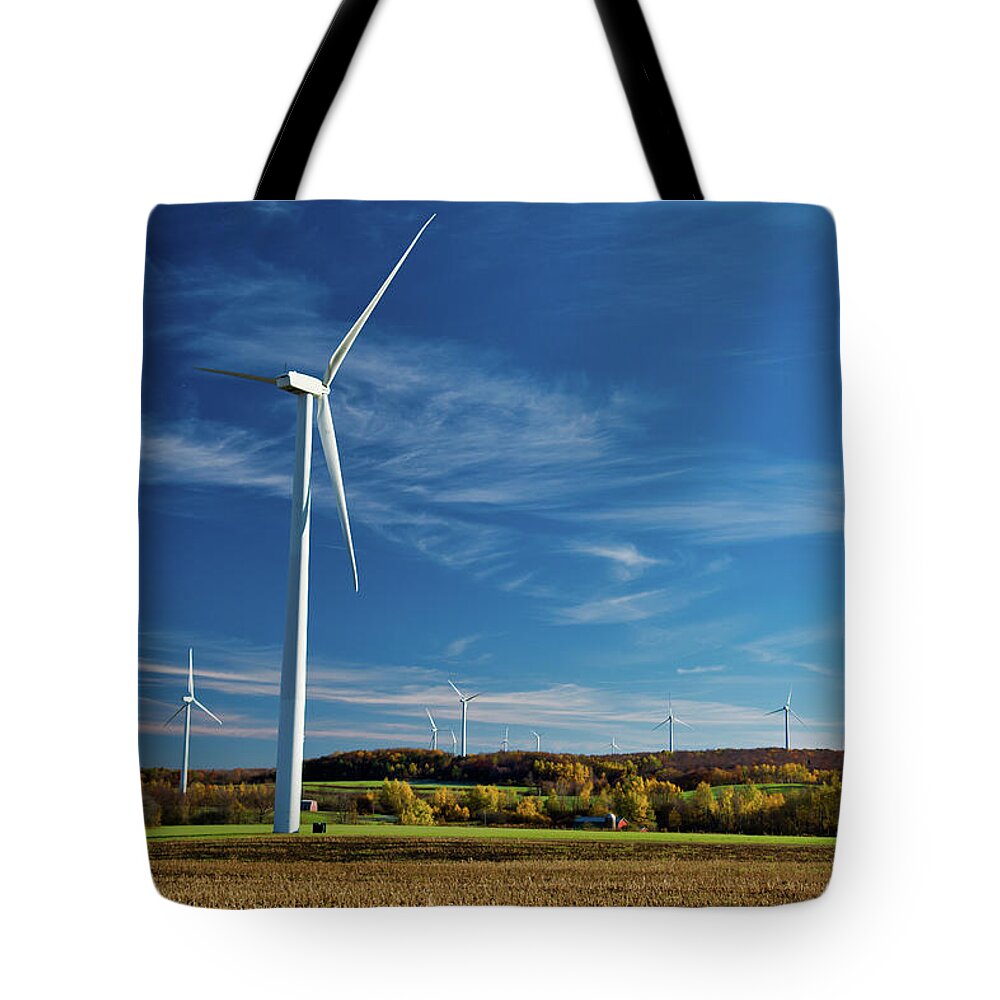 Wind Turbines Tote Bag featuring the photograph Facing the Wind by Guy Whiteley