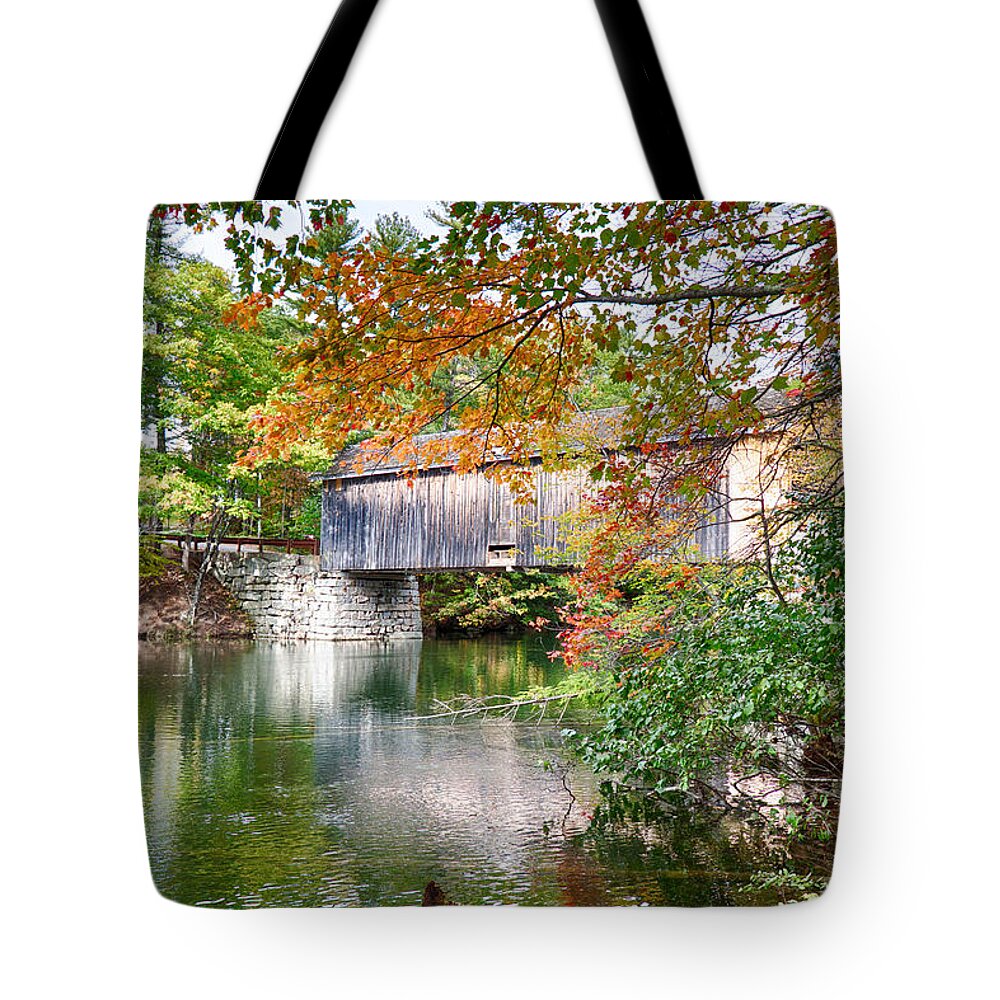 Autumn Foliage New England Tote Bag featuring the photograph Fall colors over the Babs covered bridge by Jeff Folger