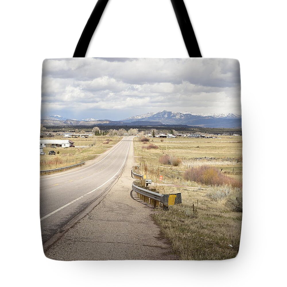 Highway; Distance; Horizon; Future; Village; Lonesome; Far Mountains; Perspective; Vista; Range; Scope; New Mexico Tote Bag featuring the photograph Far Horizon by Tom Cochran