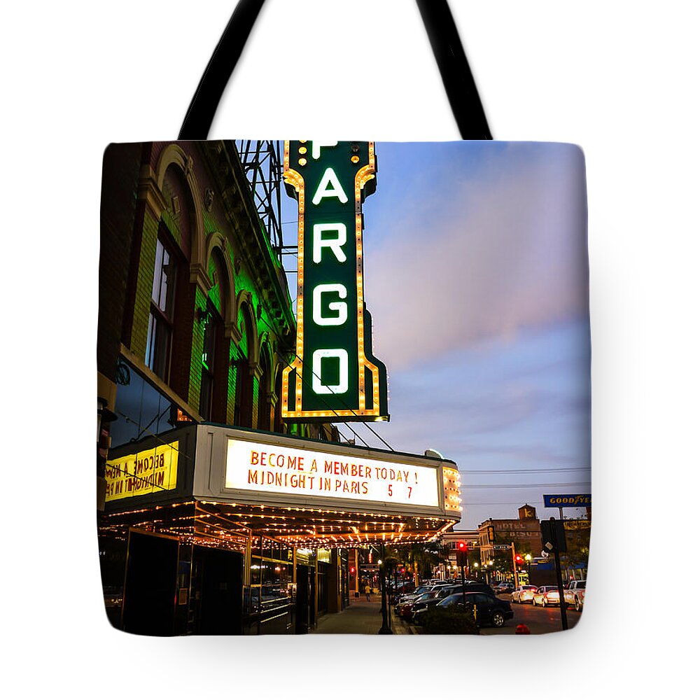 Fargo Tote Bag featuring the photograph Fargo Theater and Downtown Along Broadway Drive by Paul Velgos