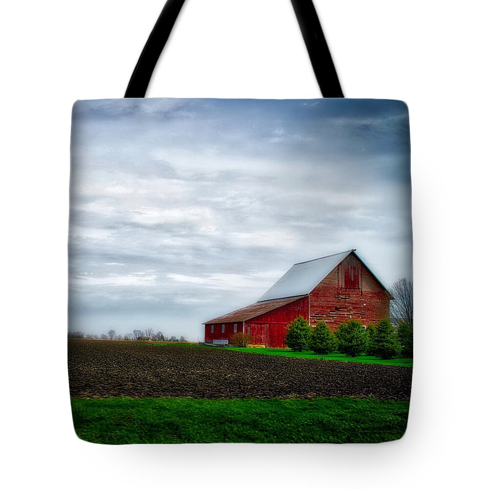 Red Barn Tote Bag featuring the photograph Farming Red Barn On A Quite Spring Day by Thomas Woolworth