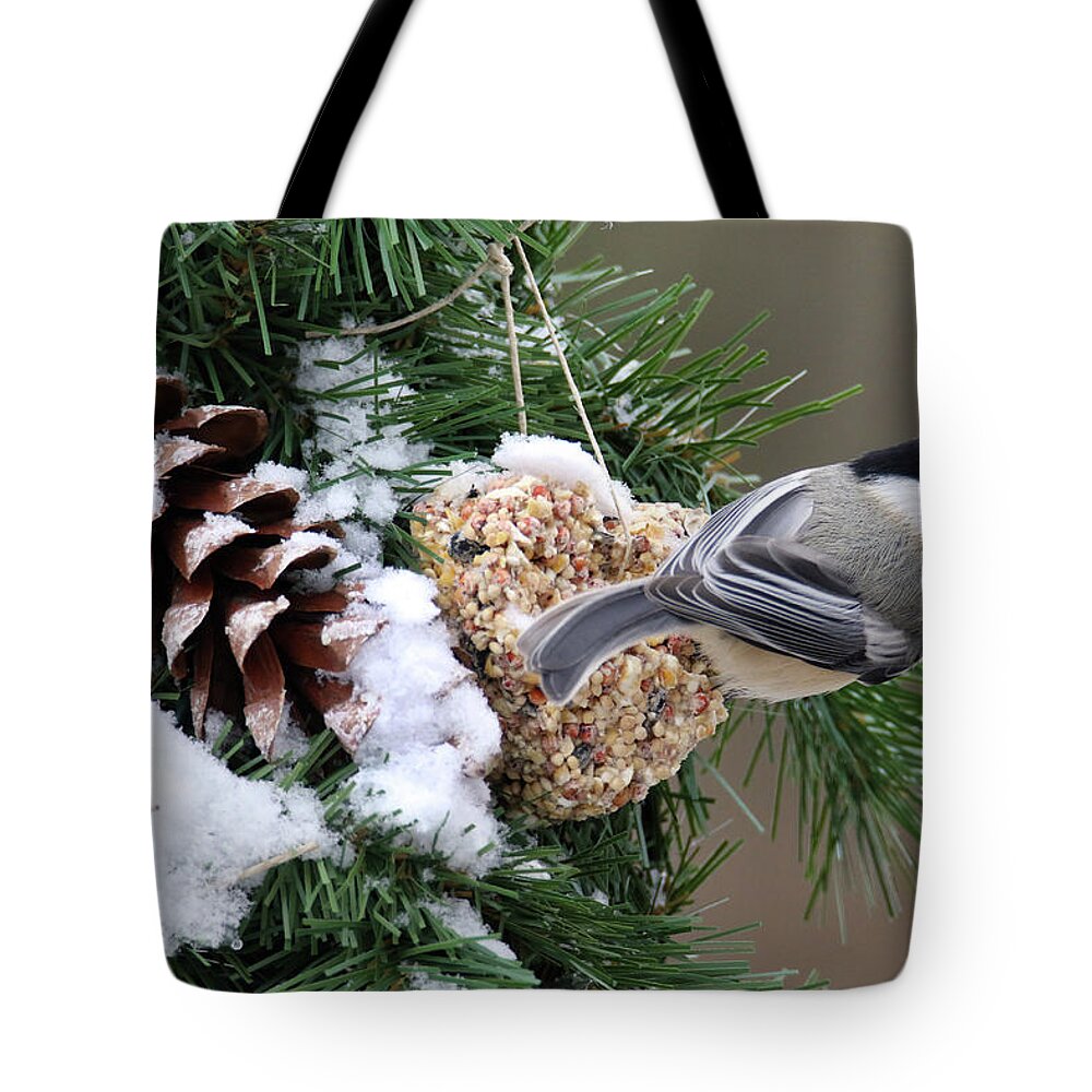 Chickadee Tote Bag featuring the photograph Feeding Feathered Friends by Brook Burling