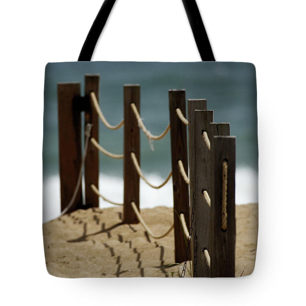 Fence Tote Bag featuring the photograph Fence Along the Beach by Julie Niemela