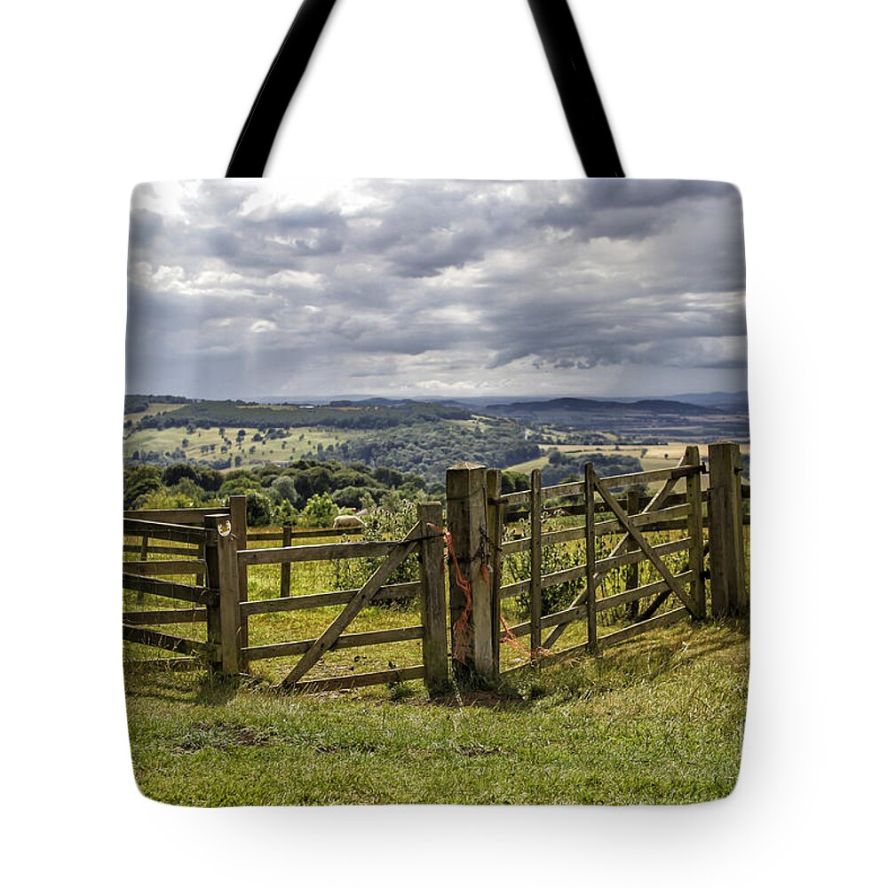 English Tote Bag featuring the photograph Fence in beautiful Cotswalds landscape by Patricia Hofmeester