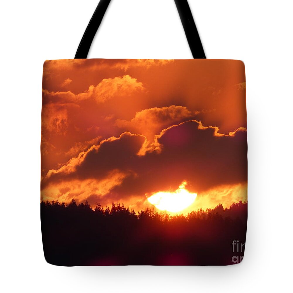 Sunset Tote Bag featuring the photograph Fiery Sunset 1 by Charles Robinson