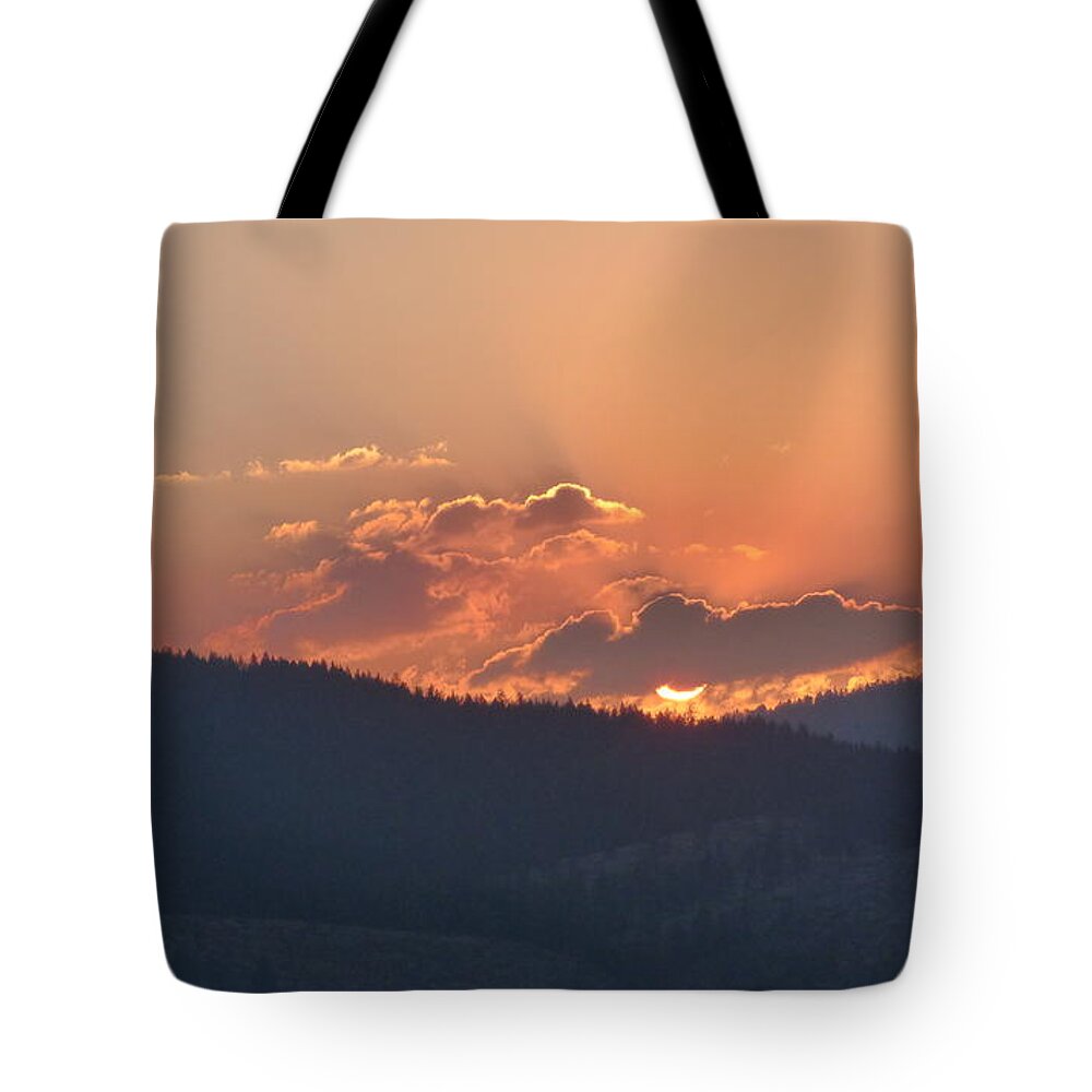 Sunset Tote Bag featuring the photograph Fiery Sunset by Charles Robinson