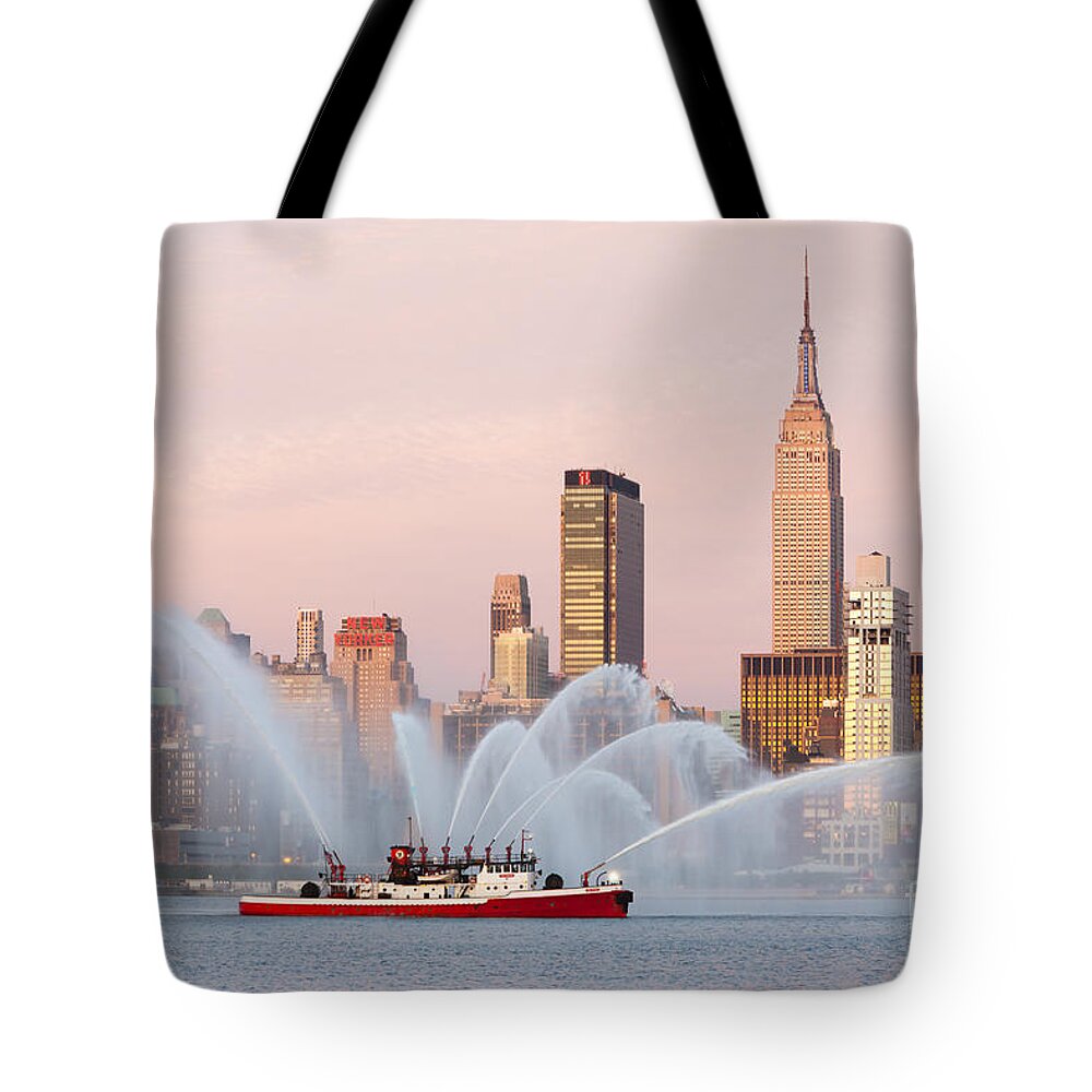 Clarence Holmes Tote Bag featuring the photograph Fire Boat and Manhattan Skyline I by Clarence Holmes