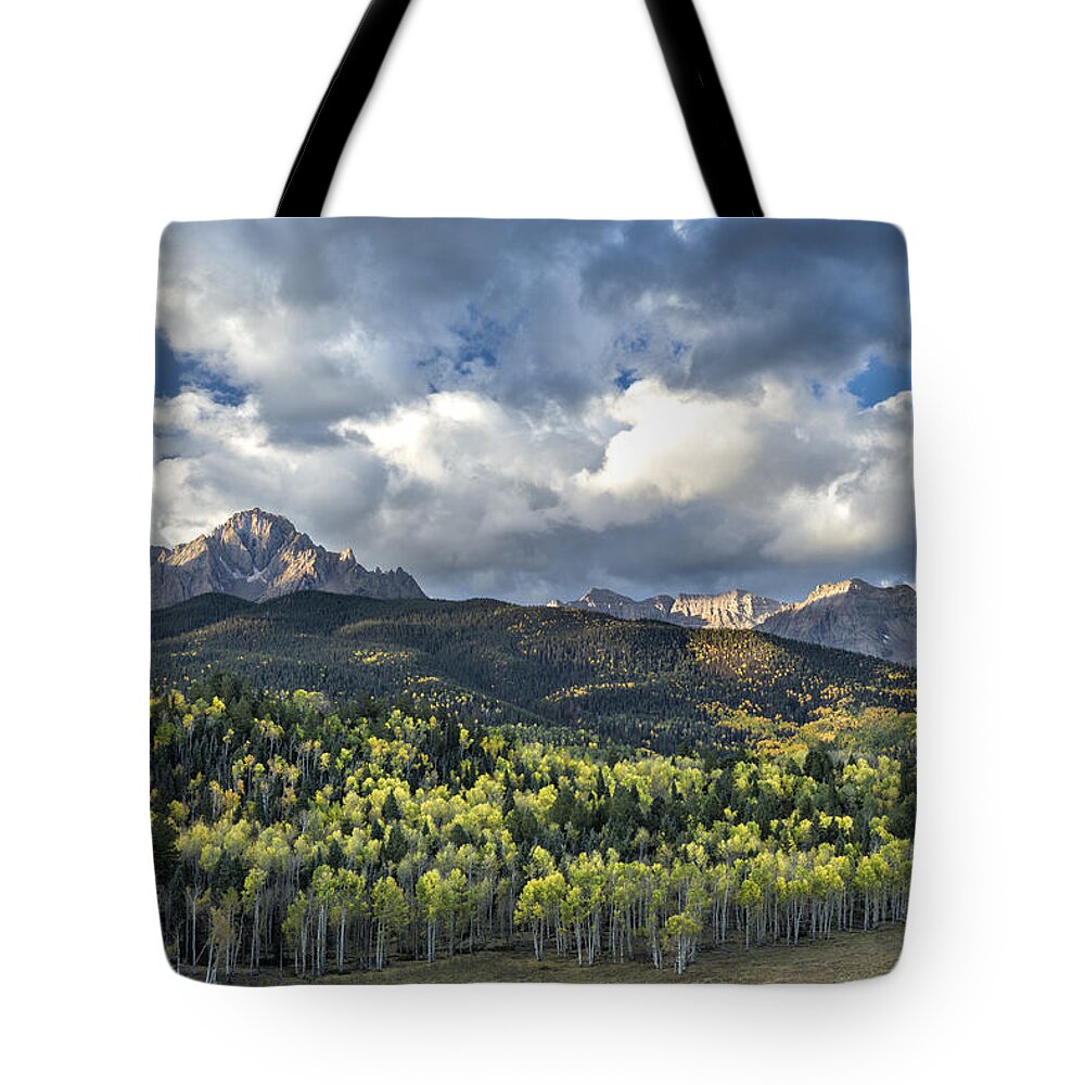 Autumn Tote Bag featuring the photograph First Light on the Sneffels Range by Denise Bush