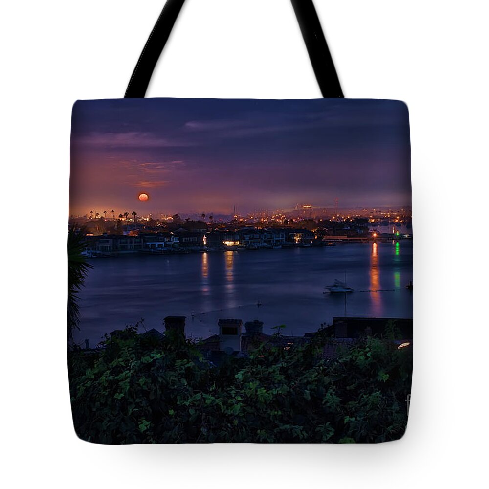 First Tote Bag featuring the photograph First Moonset of 2018 by Eddie Yerkish
