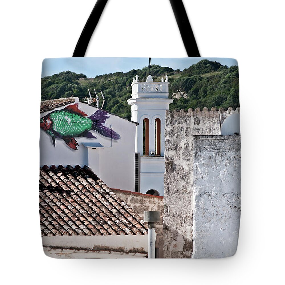 Nobody Tote Bag featuring the photograph Fish swimming in vintage town roofs by Pedro Cardona Llambias