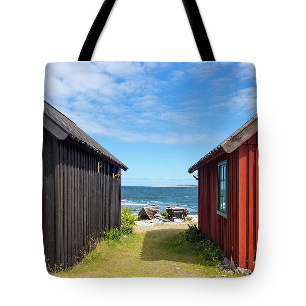 Sea Tote Bag featuring the photograph Fishing village on Faro island, Sweden by GoodMood Art