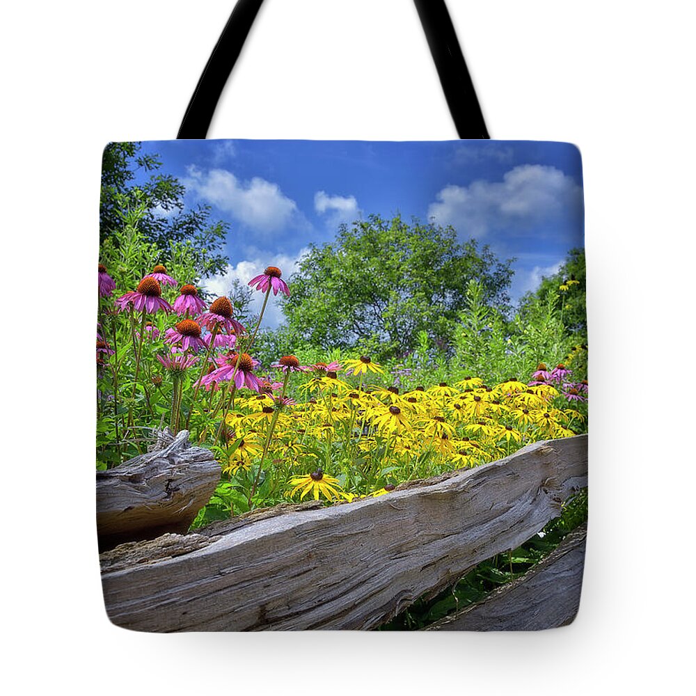 Flower Tote Bag featuring the photograph Flowers along a wooden fence by Steve Hurt