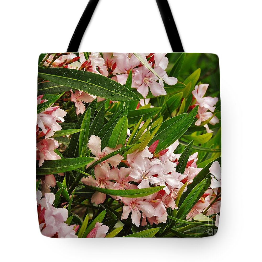 Flowers Tote Bag featuring the photograph Flowers at The Ocean by Jan Gelders