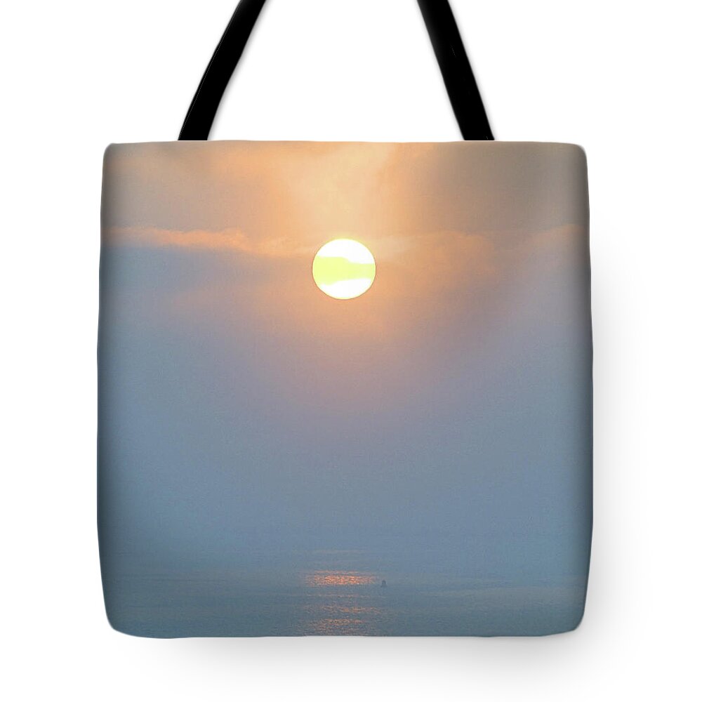 Seas Tote Bag featuring the photograph Foggy Sunrise by Newwwman