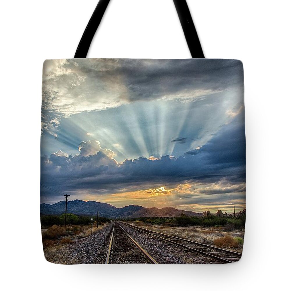 Crepuscular Tote Bag featuring the photograph Follow the rays by Gaelyn Olmsted