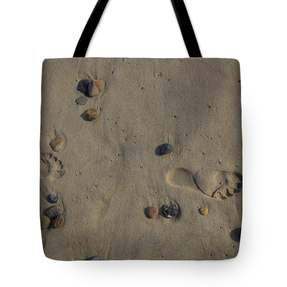 Montauk Ny Tote Bag featuring the photograph Footprints in the sand by Steve Gravano