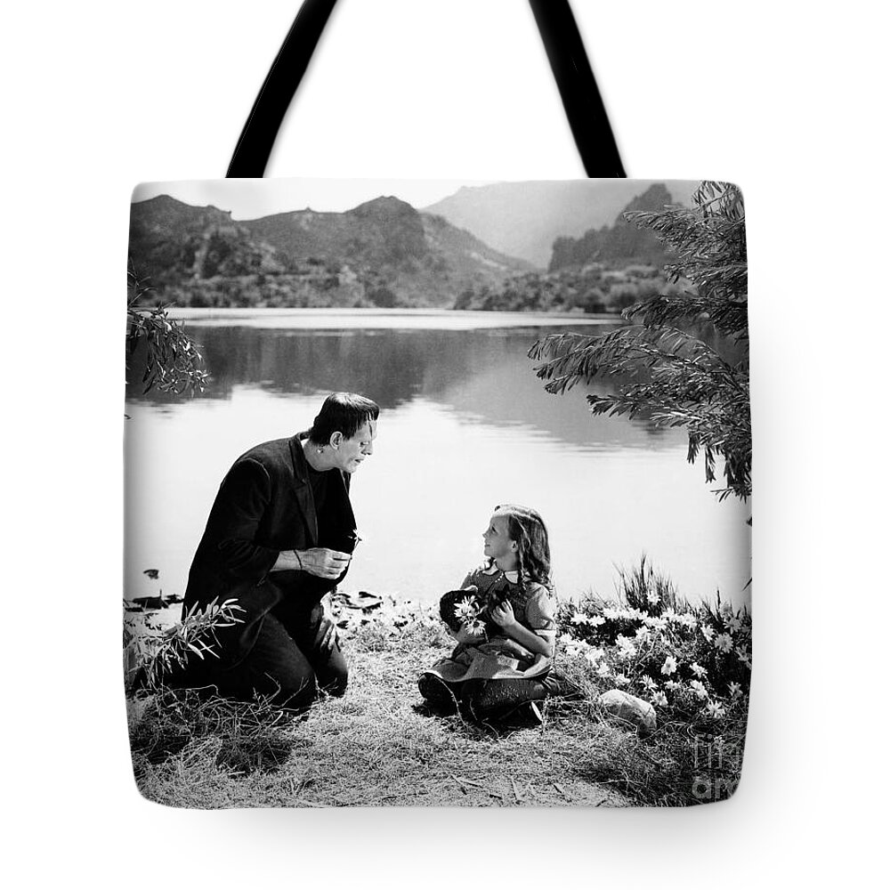 Frankenstein Tote Bag featuring the photograph Frankenstein by the lake with little girl Boris Karloff by Vintage Collectables