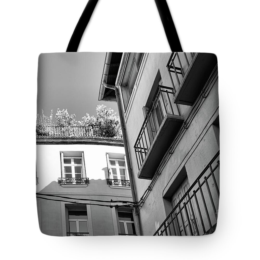 France Tote Bag featuring the photograph French Building Shutters Balcony BW by Chuck Kuhn