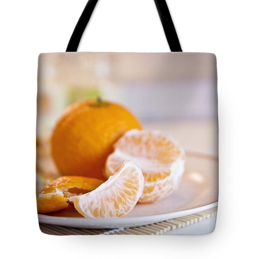 Orange Tote Bag featuring the photograph Freshly peeled citrus by Cindy Garber Iverson