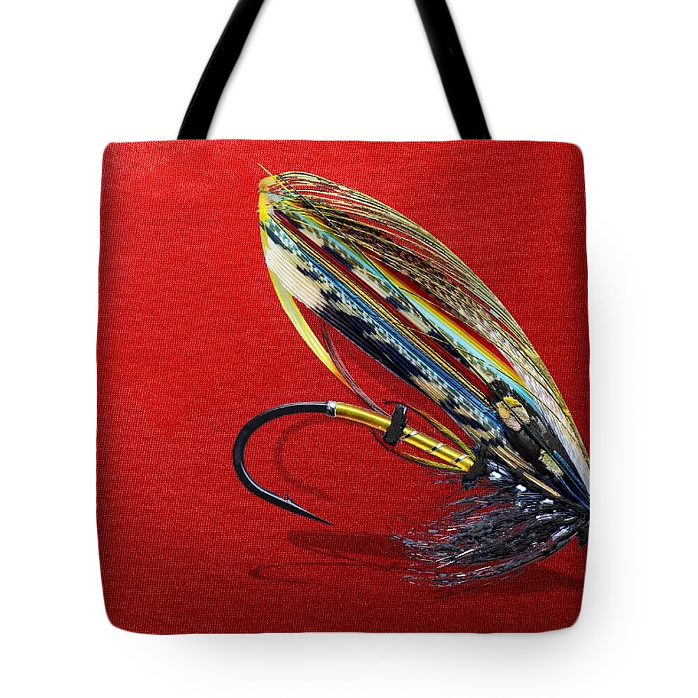 Fishing Corner Collection By Serge Averbukh Tote Bag featuring the photograph Fully Dressed Salmon Fly on Red by Serge Averbukh
