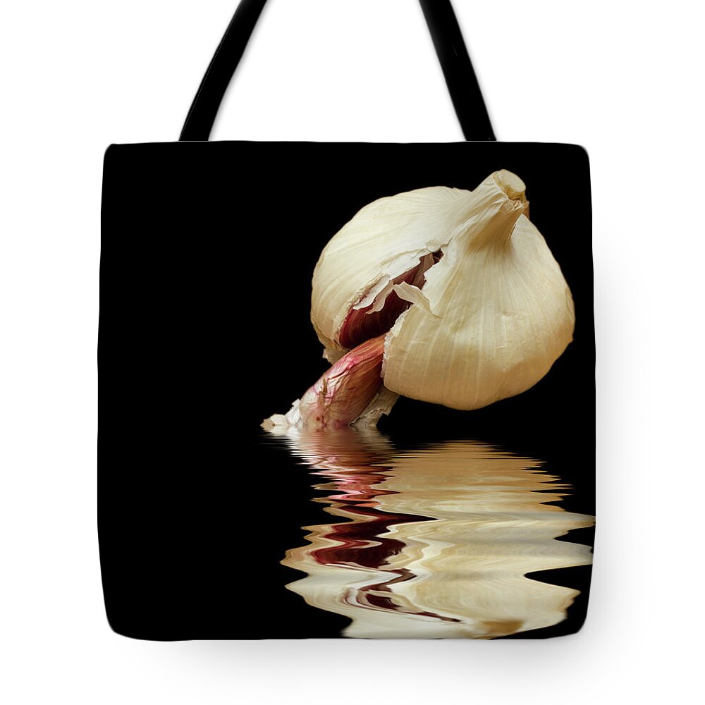 Garlic Tote Bag featuring the photograph Garlic cloves of Garlic by David French