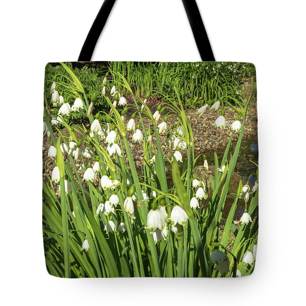 Giant Lilies Of The Valley By Marina Usmanskaya Tote Bag featuring the photograph Giant lilies of the valley by Marina Usmanskaya
