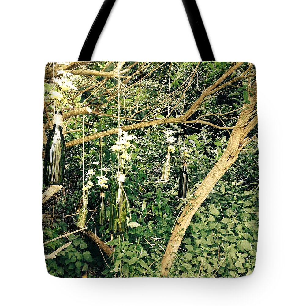 Daisy Tote Bag featuring the photograph Glass bottles by Charlotte Claydon