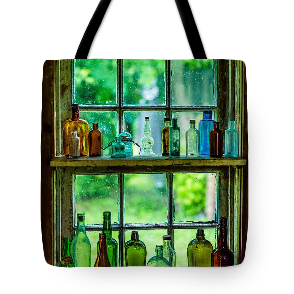 Glass Bottles In Window Tote Bag featuring the photograph Glass Bottles in a Window by M G Whittingham