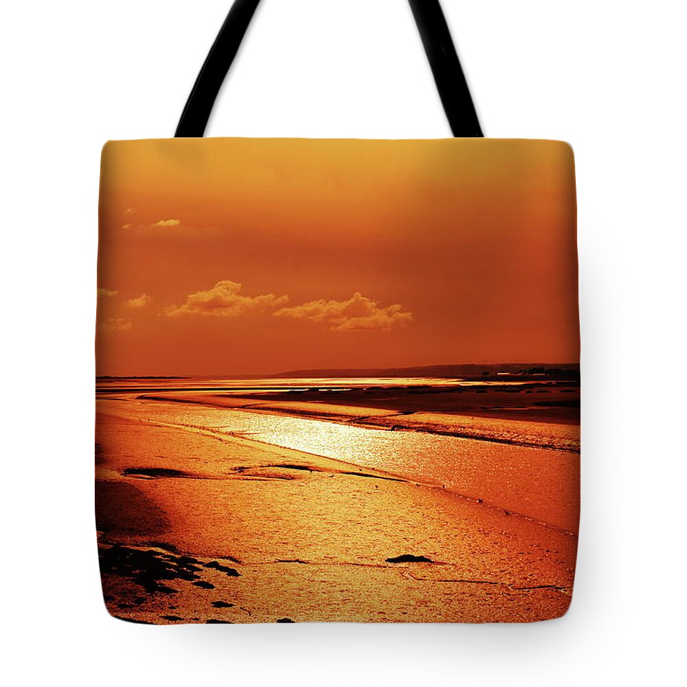 Golden Glow Tote Bag featuring the photograph Glow across the Estuary by Jeff Townsend