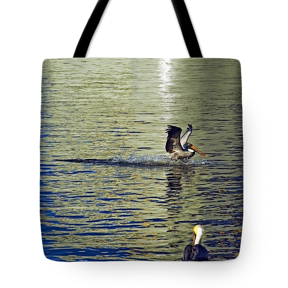 Pelican Landing Tote Bag featuring the photograph Golden Landing by Robert Brown