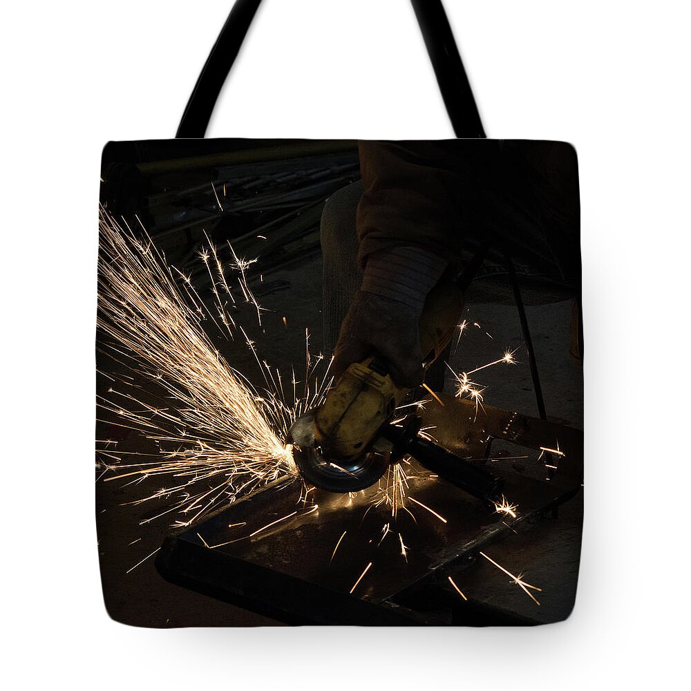 Grinding Tote Bag featuring the photograph Grinding Steel by Michael Hall