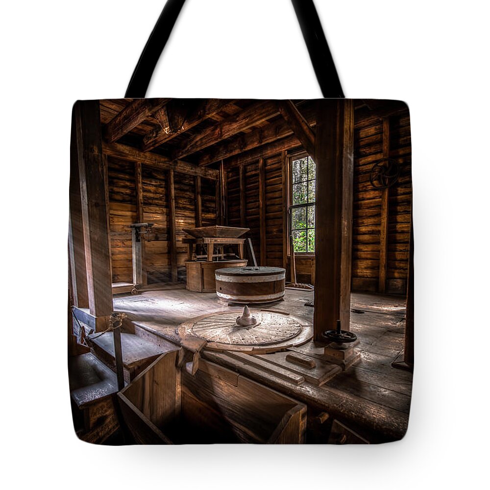 Appalachian Tote Bag featuring the photograph Grindstone at the Mingus Mill by David Morefield