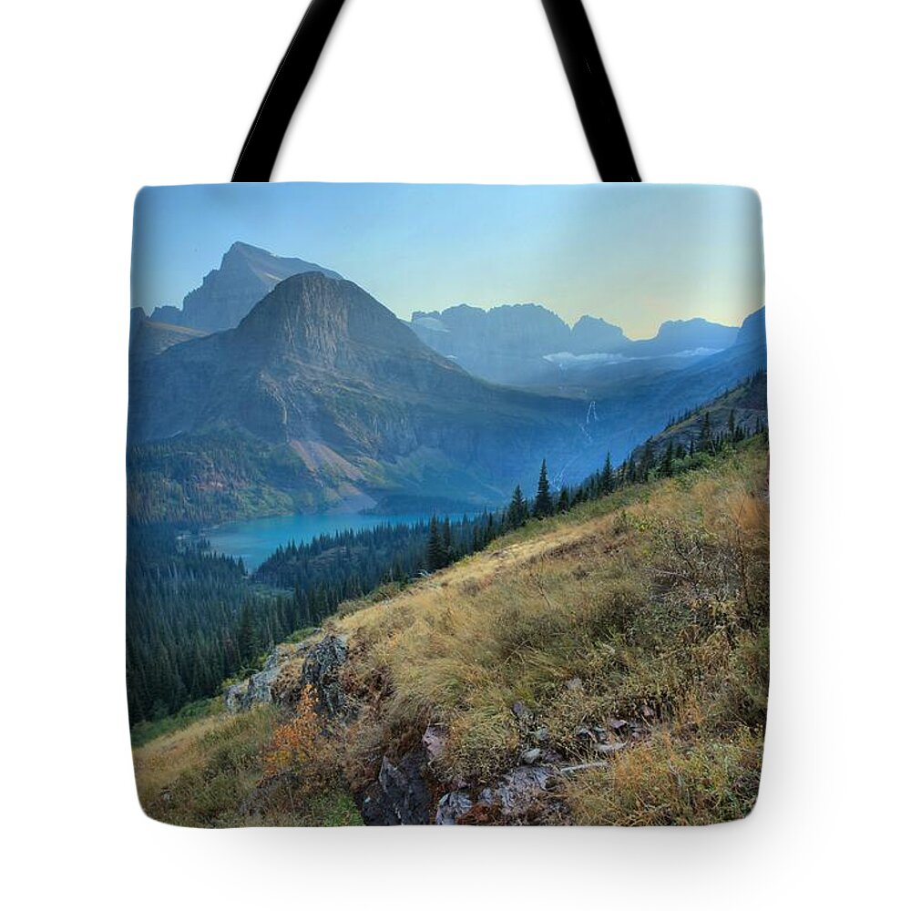 Grinnell Tote Bag featuring the photograph Grinnell Glacier Trail Hiker by Adam Jewell