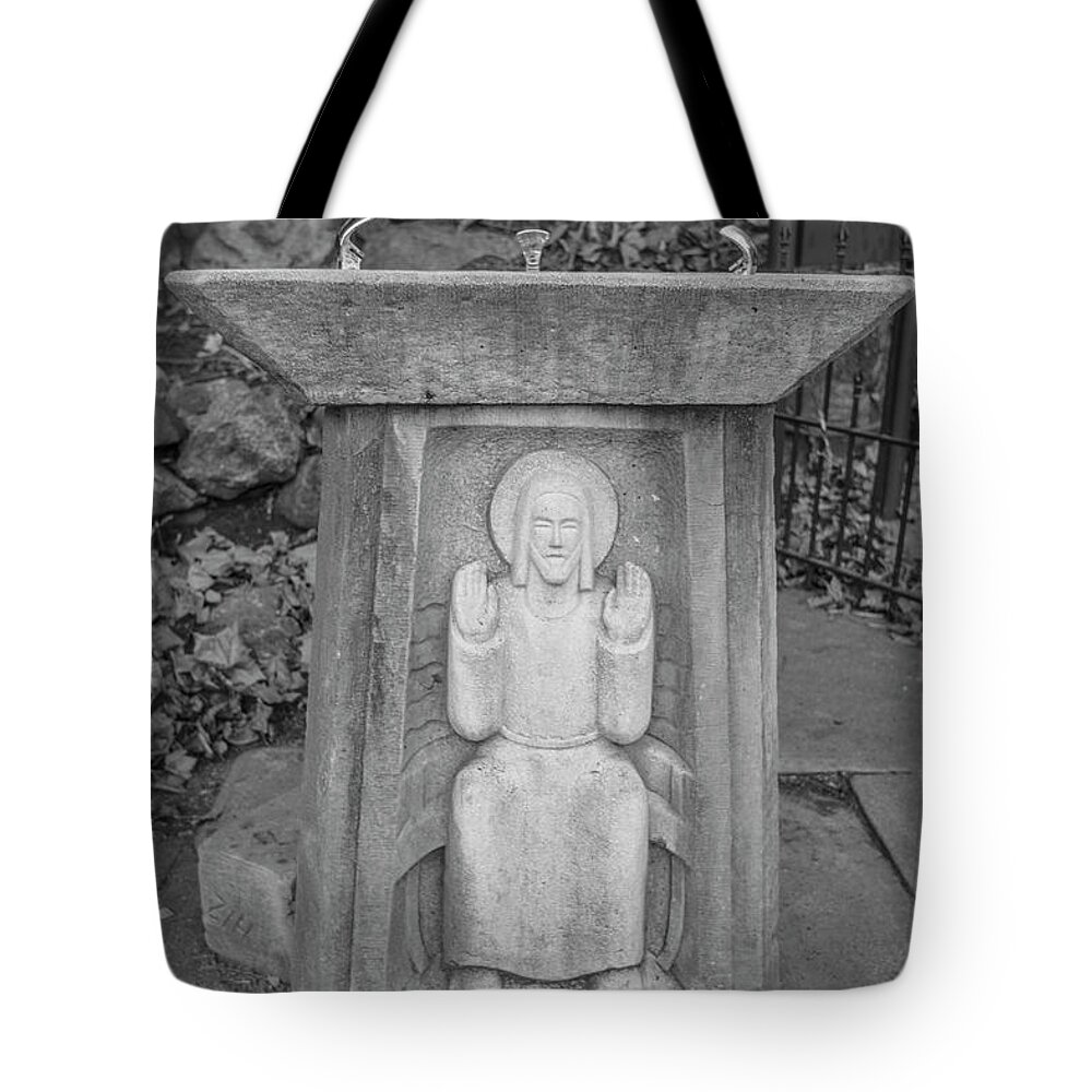 American University Tote Bag featuring the photograph Grotto of Our Lady of Lourdes drinking fountain by John McGraw