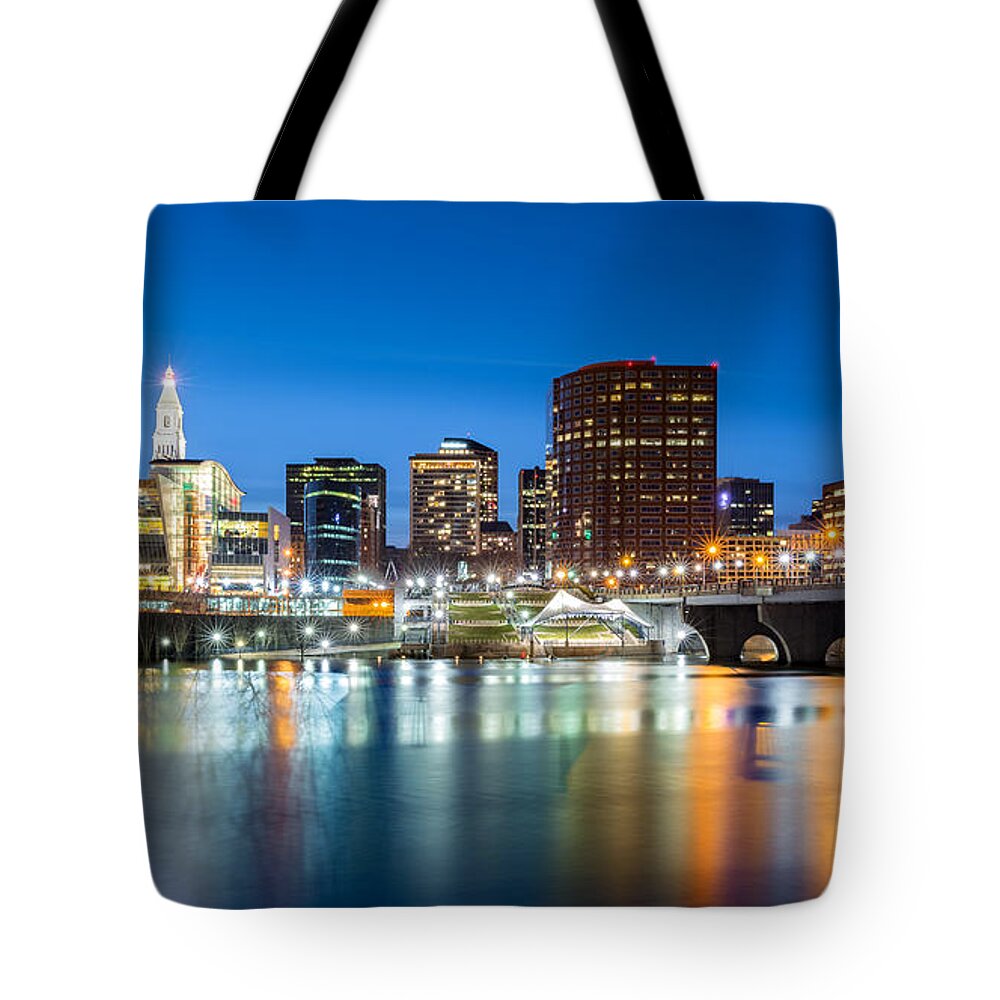 America Tote Bag featuring the photograph Hartford skyline and Founders Bridge at dusk by Mihai Andritoiu