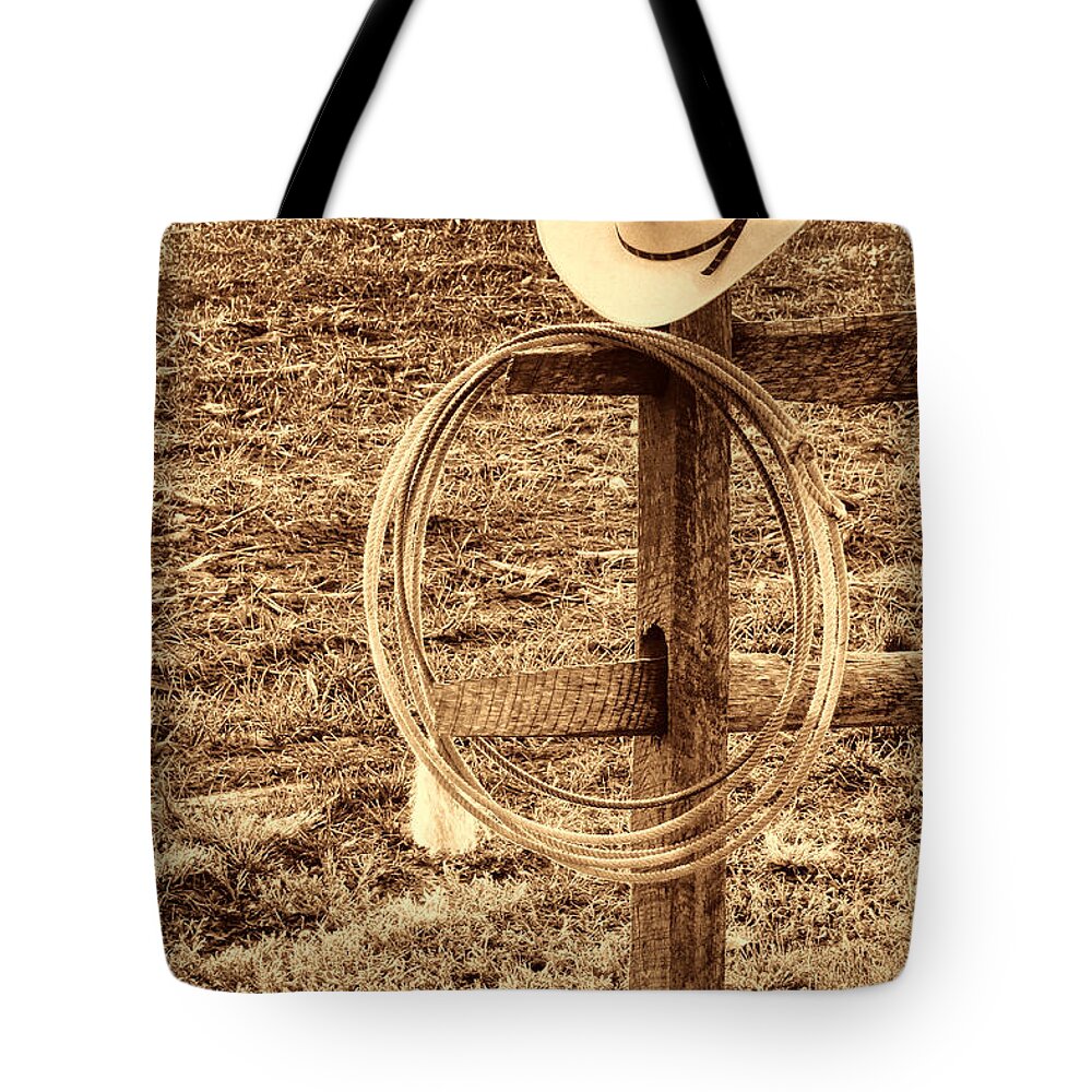 Cowboy Tote Bag featuring the photograph Hat and Lariat on a Post by American West Legend By Olivier Le Queinec