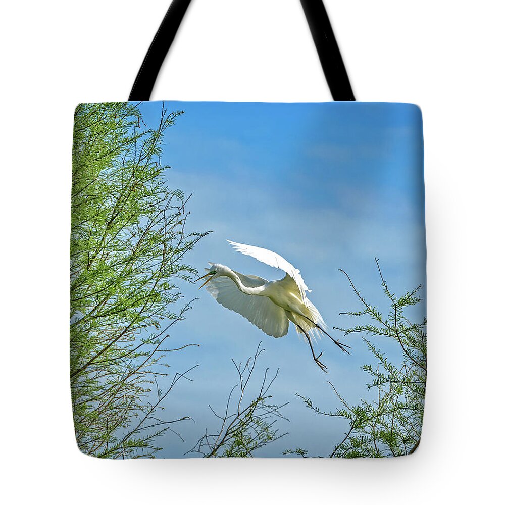 Egrets Nesting Rookery Tote Bag featuring the photograph Heading Home by Mike Covington