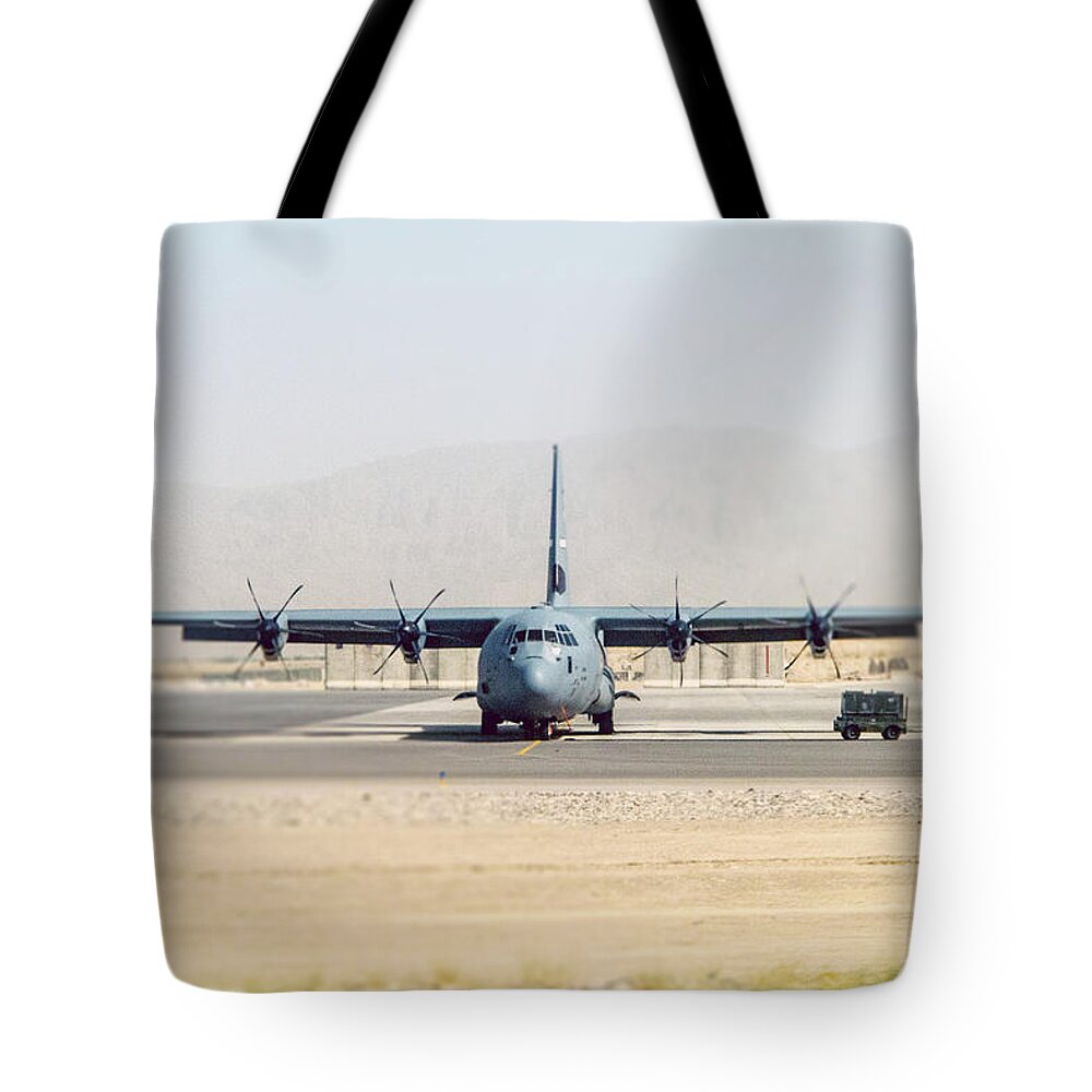 Apu Tote Bag featuring the photograph Hercules C-130 on Runway by SR Green
