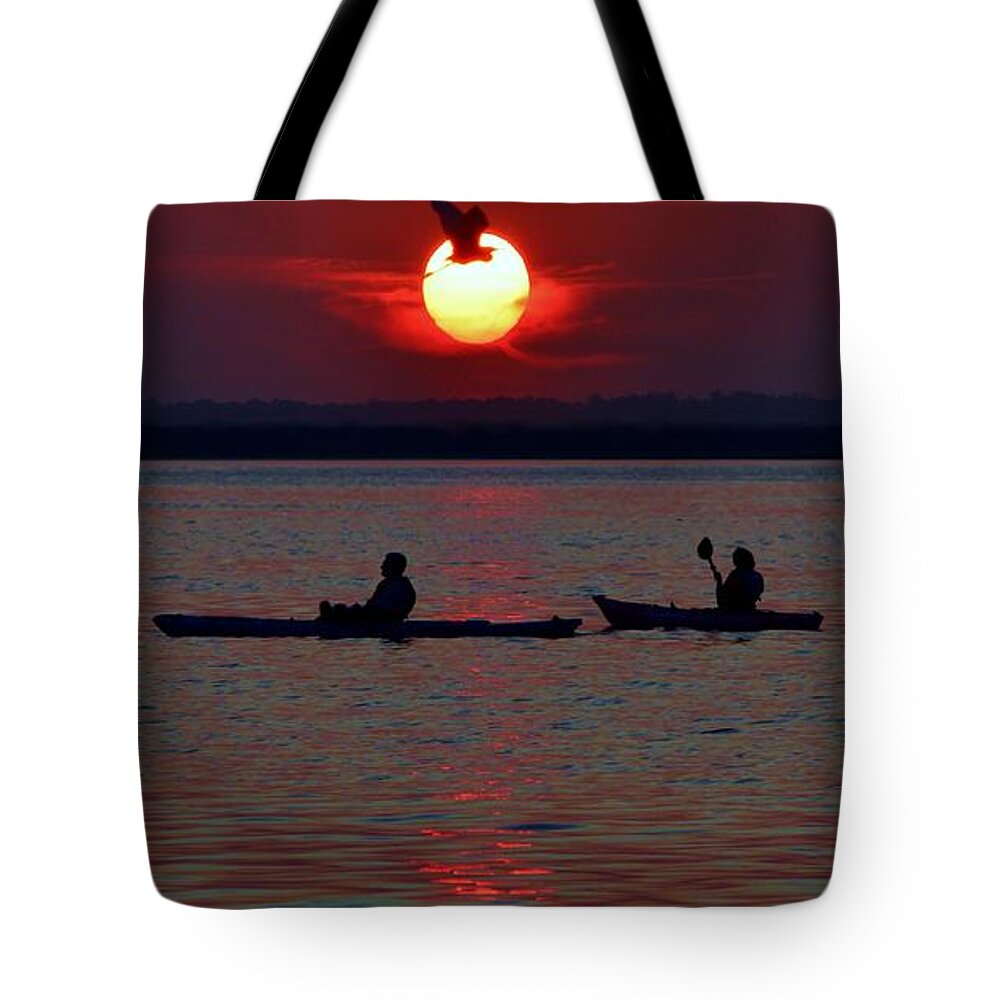 Beach Bum Pics Tote Bag featuring the photograph Heron and Kayakers Sunset by Billy Beck
