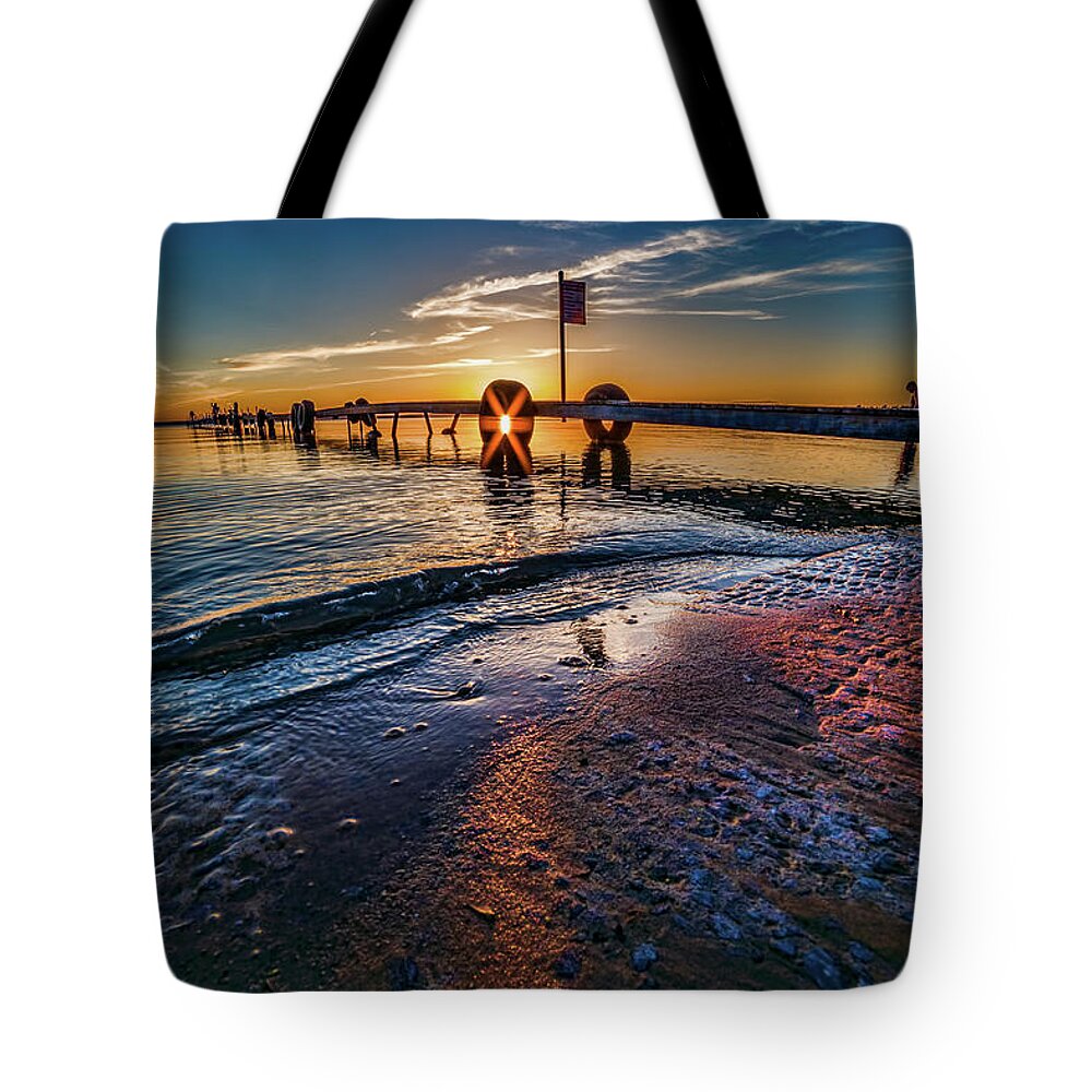 Sunflare Tote Bag featuring the photograph Higgins Lake Maplehurst Dock Sunflare by Joe Holley