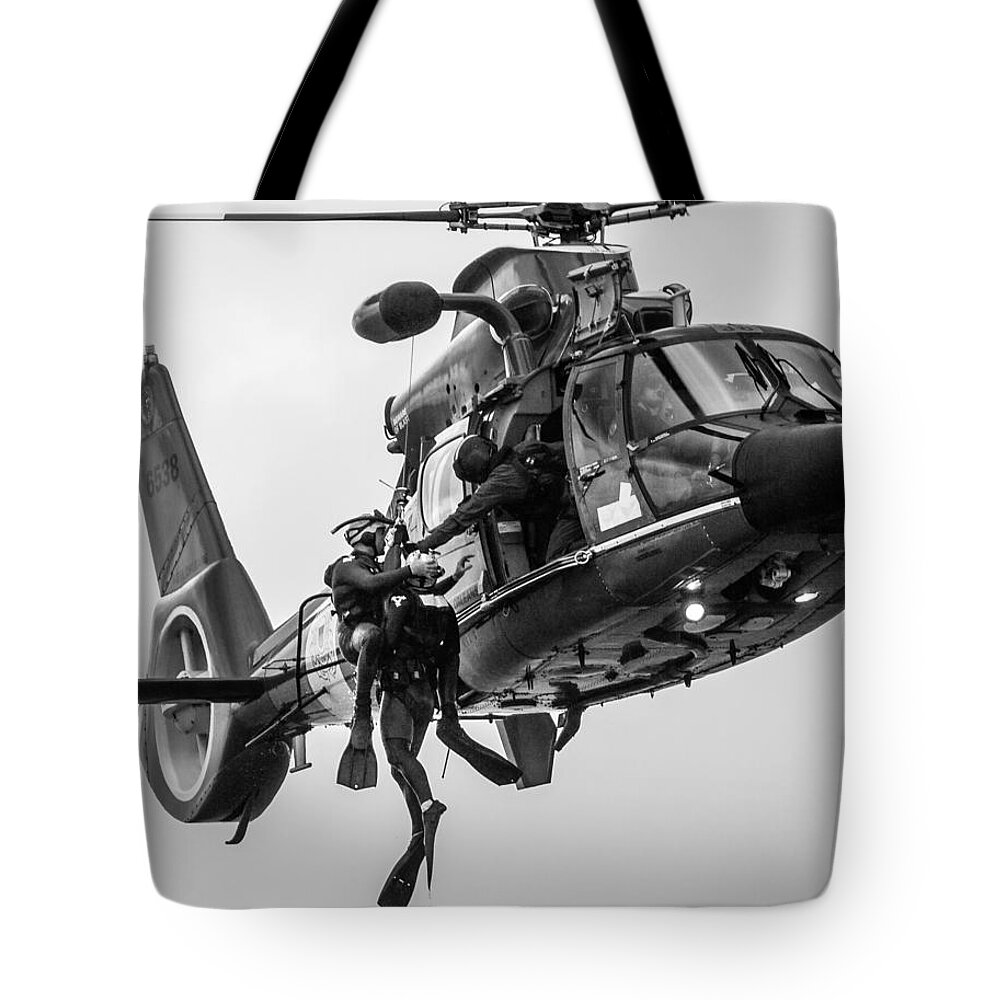 1 Pid Color Open Tote Bag featuring the photograph Hoisting Victim into Helicopter by Gregory Daley MPSA