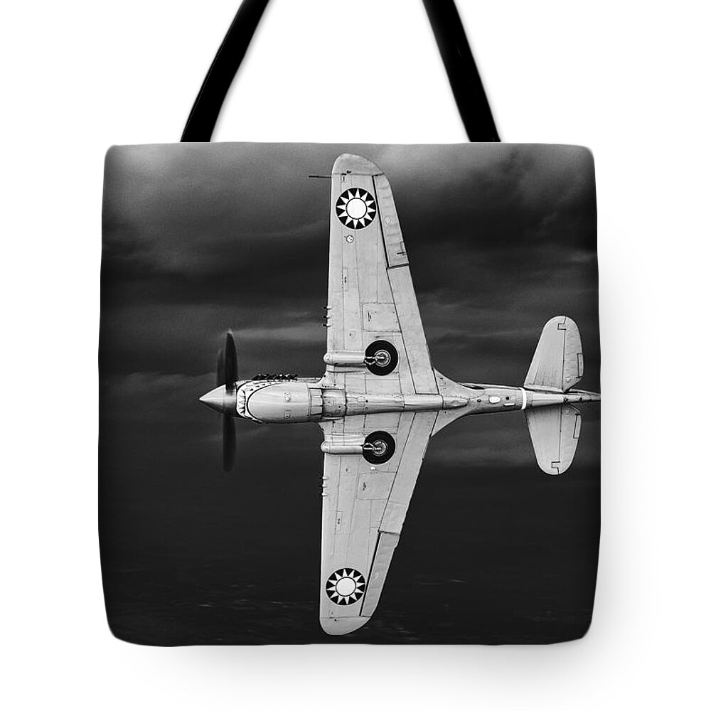 Curtiss Tote Bag featuring the photograph Holding Back The Storm by Jay Beckman