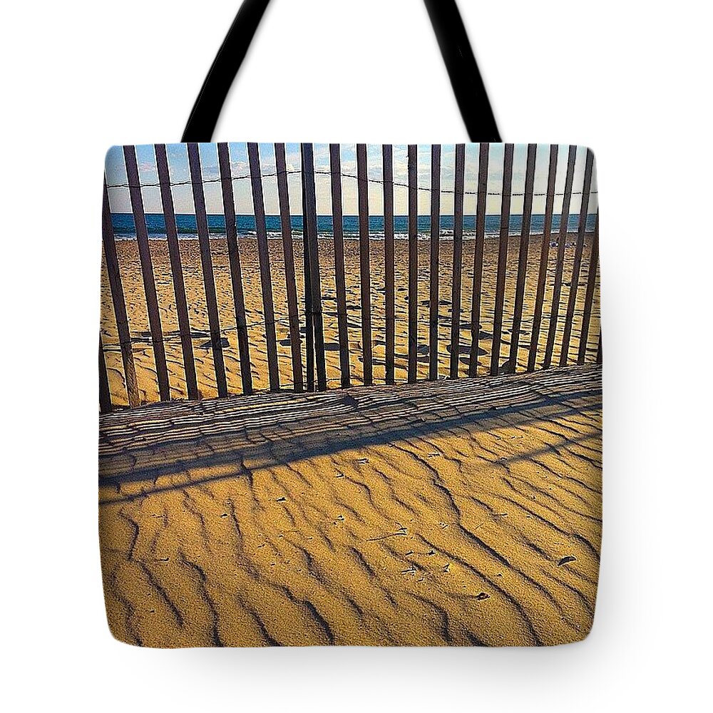 Sand Tote Bag featuring the photograph The Fence Between by Kate Arsenault 