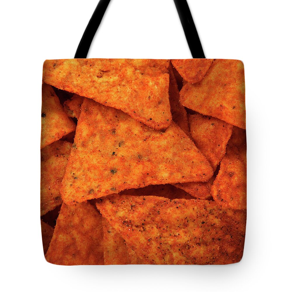 Chips Tote Bag featuring the photograph Hot corn chips background by GoodMood Art