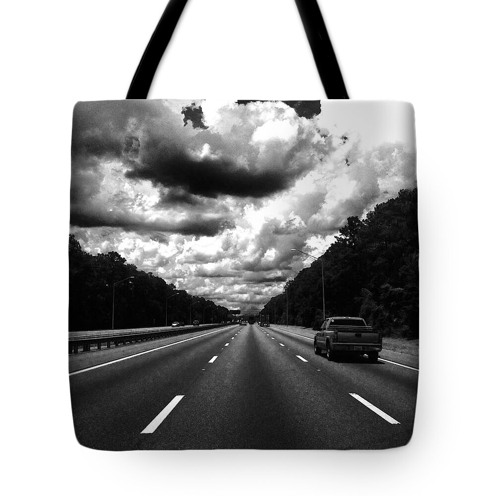 Clouds Tote Bag featuring the photograph I95 clouds by WaLdEmAr BoRrErO