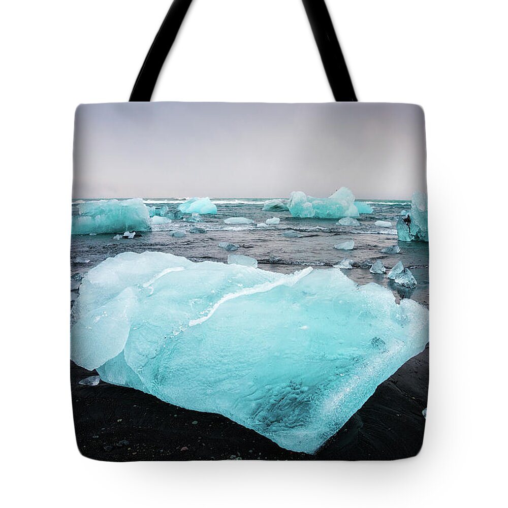Iceland Tote Bag featuring the photograph Iceberg pieces in Iceland Jokulsarlon by Matthias Hauser