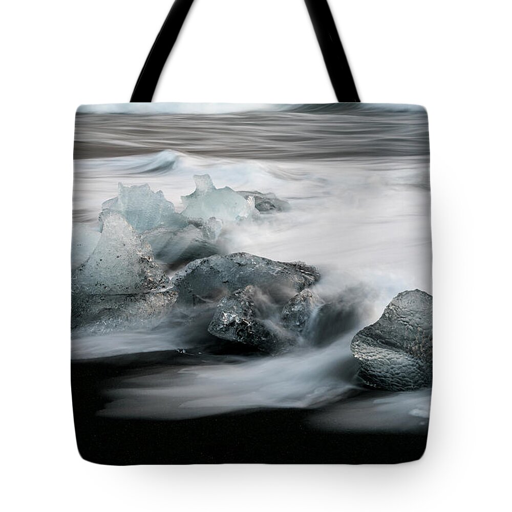 Icebergs Tote Bag featuring the photograph Icebergs in ice beach, Iceland by Michalakis Ppalis