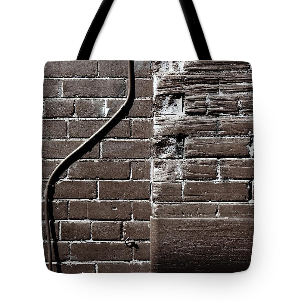Brown Tote Bag featuring the photograph In Defiance Of Rigidity by Kreddible Trout