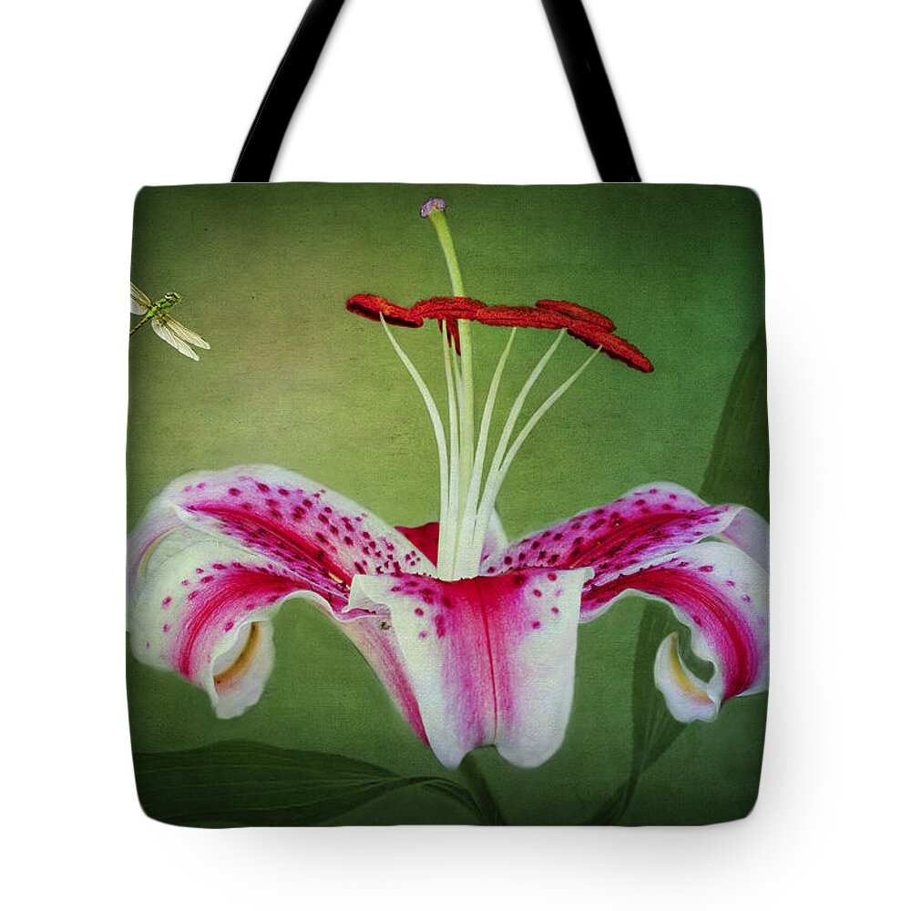 Stargazer Lilies Tote Bag featuring the photograph In Love by Marina Kojukhova